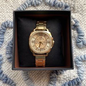 Brand new, never worn Coach gold tone watch.